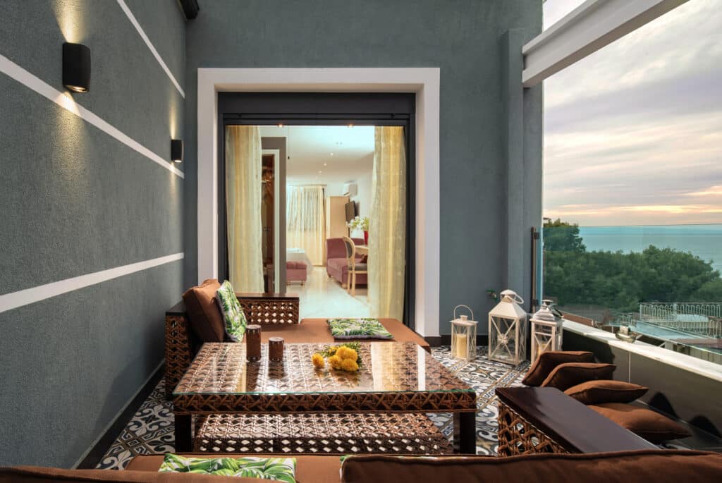 Oriental style interior of open air terrace with wicker furniture in luxury hotel. traditional arabic decoration of living room in modern apartment